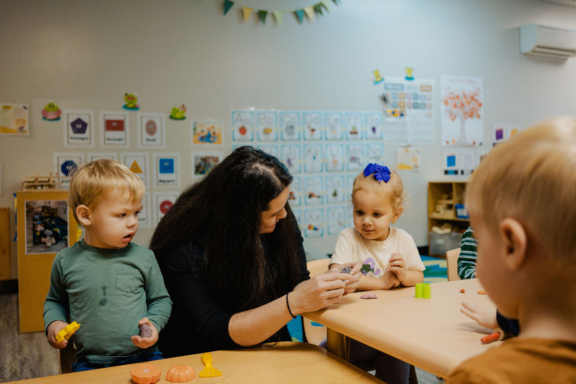Thrive Early Learning teacher with children
